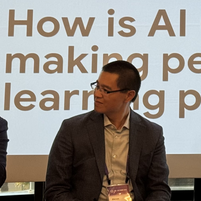 Steven Tom speaking during an artificial intelligence panel
