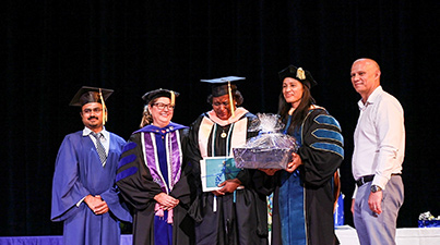 Graduate Jacqueline receives an award Graduate Jacqueline receives an award