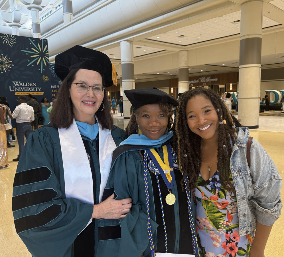 A group of people posing for a photo at a graduation