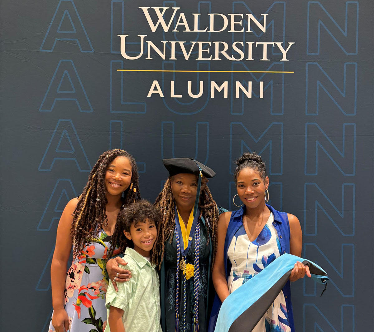 A group of people posing for a photo at a graduation