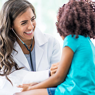 doctor laughing with a child