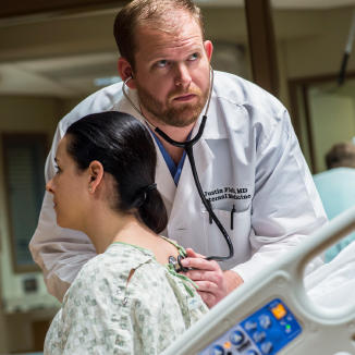 doctor examining a patient with a stethoscope