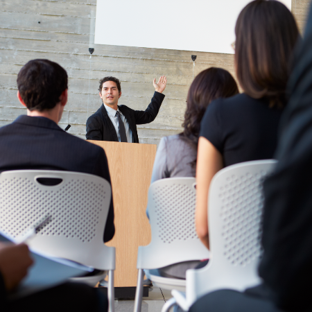 Man presenting to a group of people