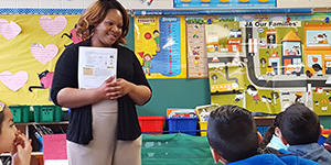 Woman standing in front of a classroom