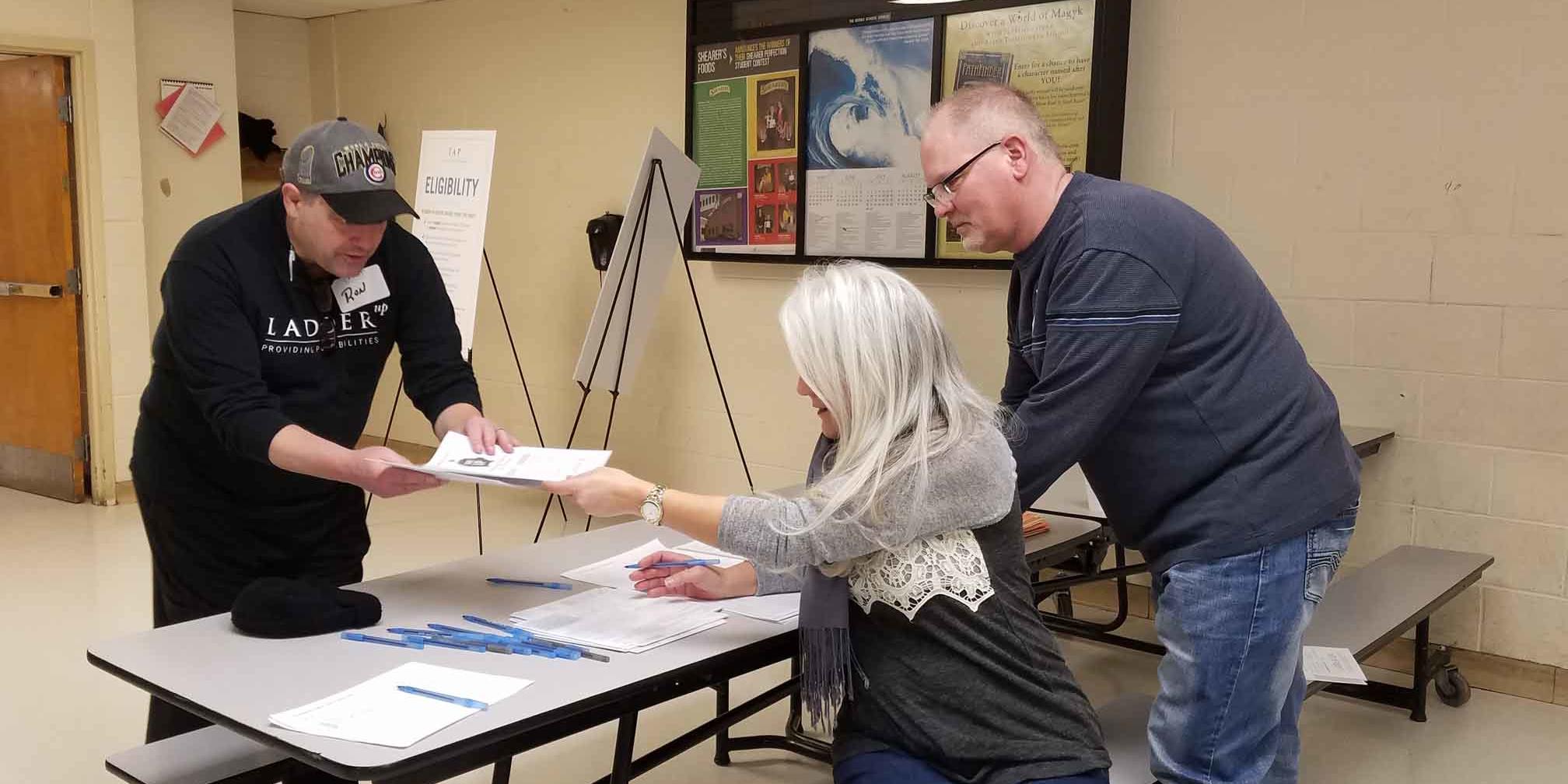 Volunteer helping people with tax returns