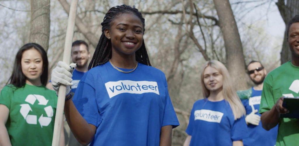 students volunteering outdoors