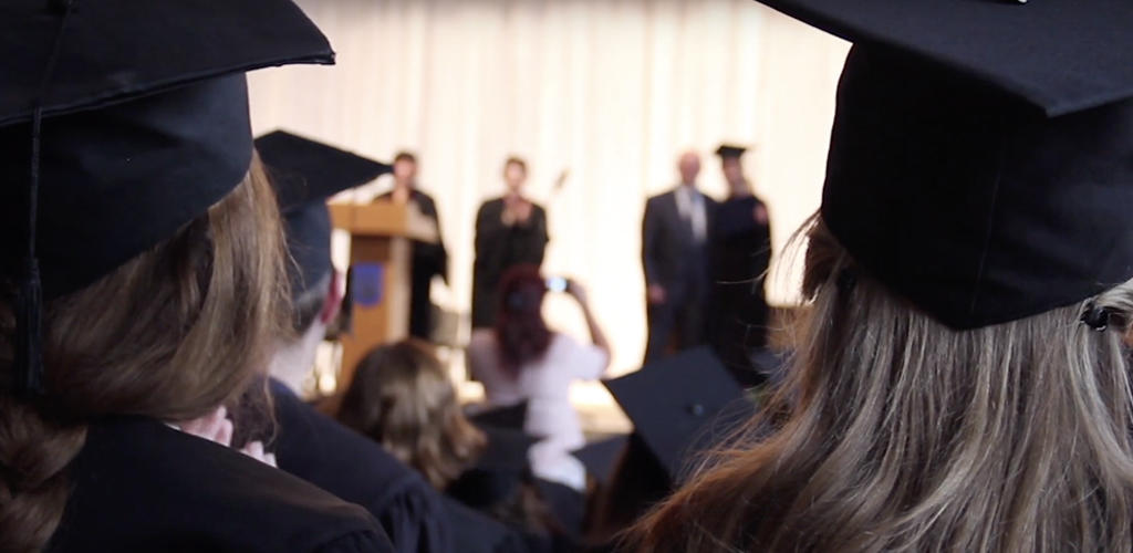 Graduates sitting at commencement