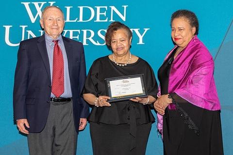 Dr. Yvonne D. Greer accepting a Walden University award
