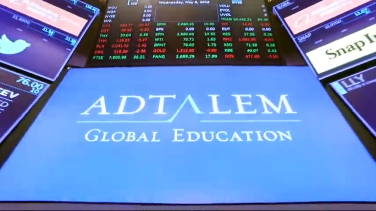 Adtalem logo appears on screen below stock exchange updates