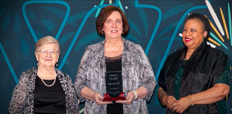 "Dr. Judi Kuric Pictured with Award"