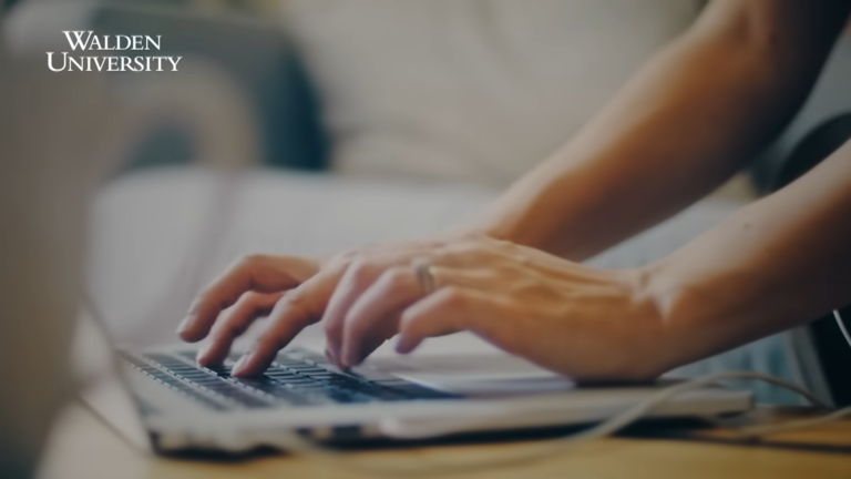 hands typing on a laptop