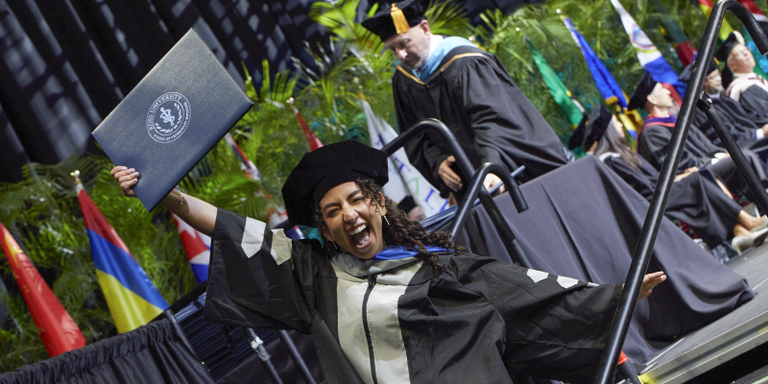 Student celebrating at graduation