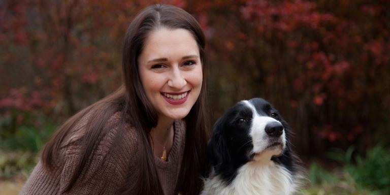 Woman with black and white dog