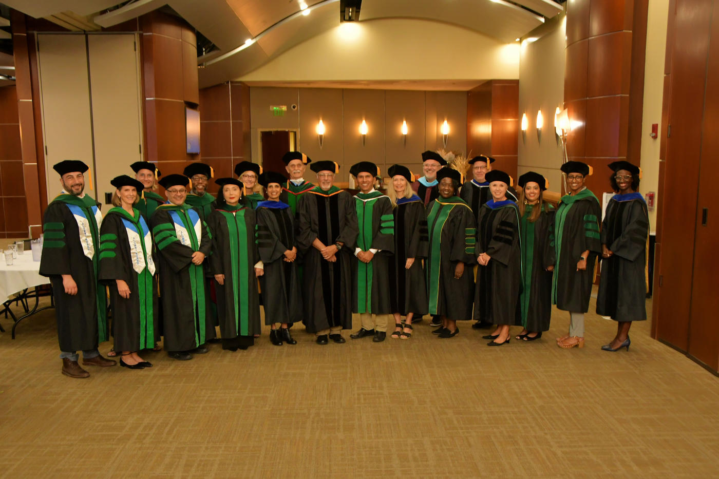 Group of students in robes are commencement