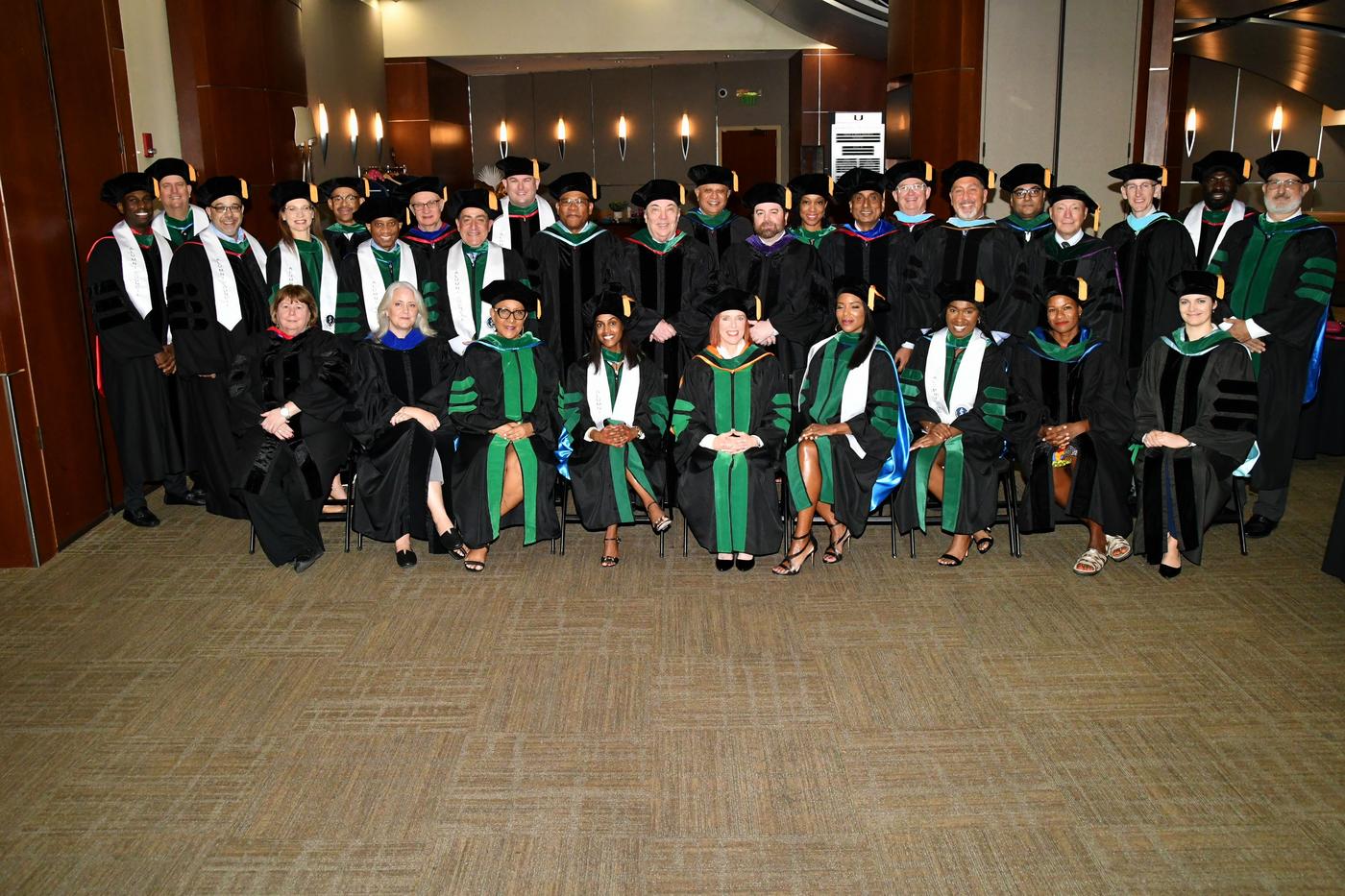 Group of students in robes are commencement