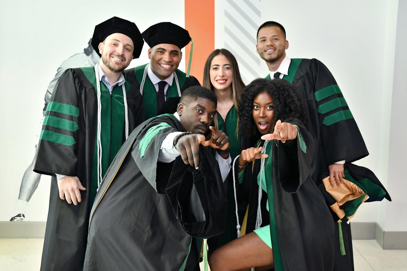 Group of students in robes are commencement