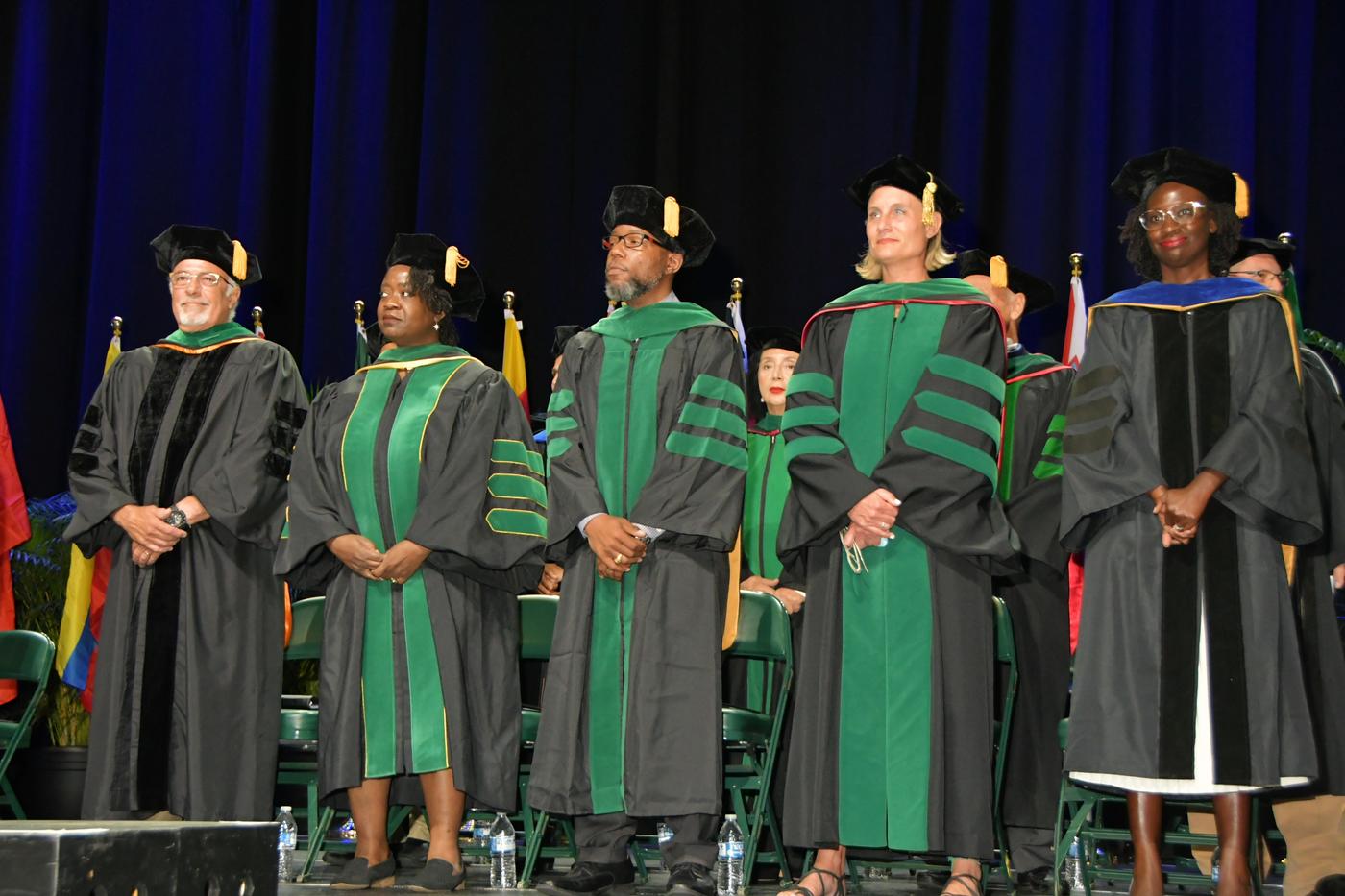 Group of students in robes are commencement