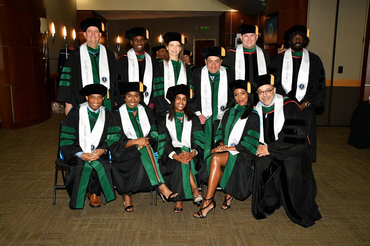 Group of students in robes are commencement