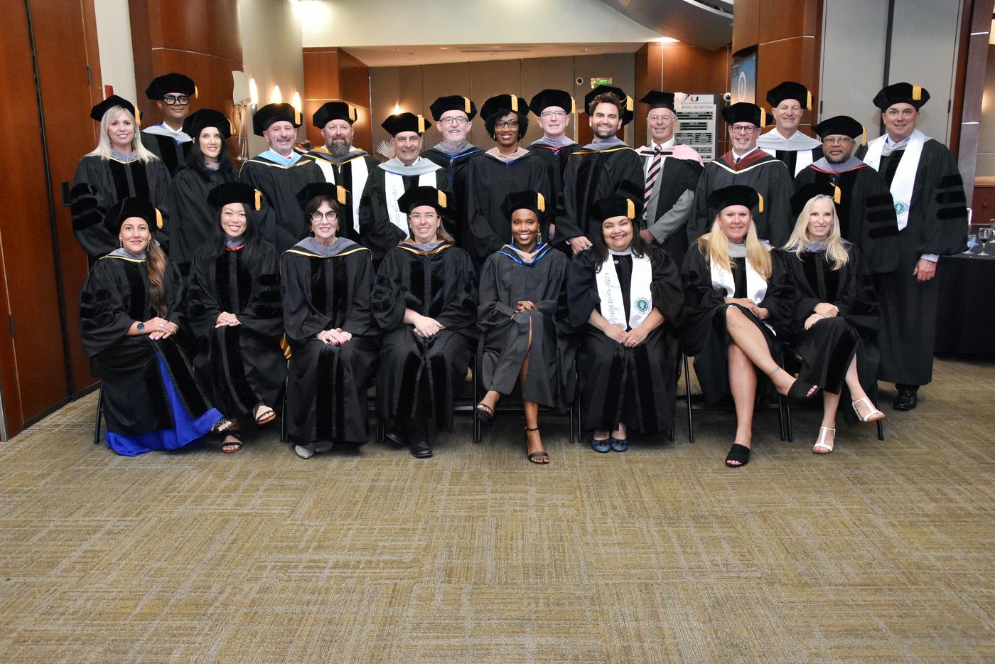 Group of students in robes are commencement