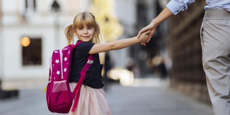 a child holding an adult's hand