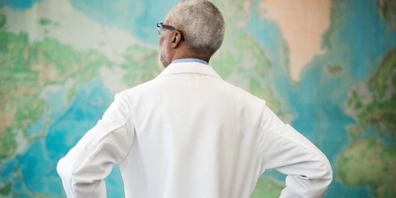 a healthcare professional analyzing a global map