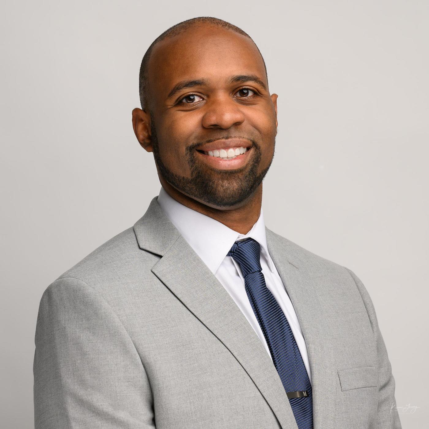 a headshot of Dr. Marcus Robinson