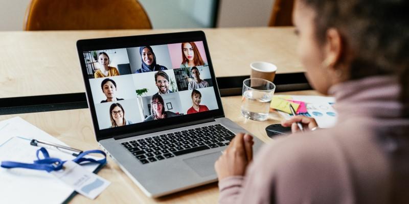 a student meeting people virtually on a laptop