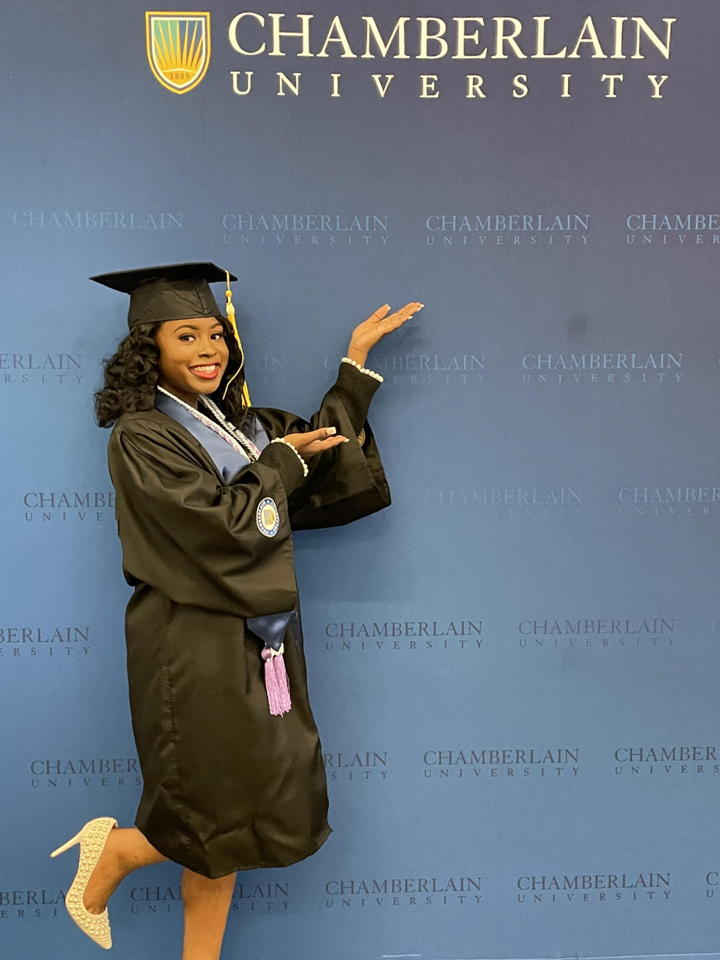 Torrange Taylor in her commencement regalia
