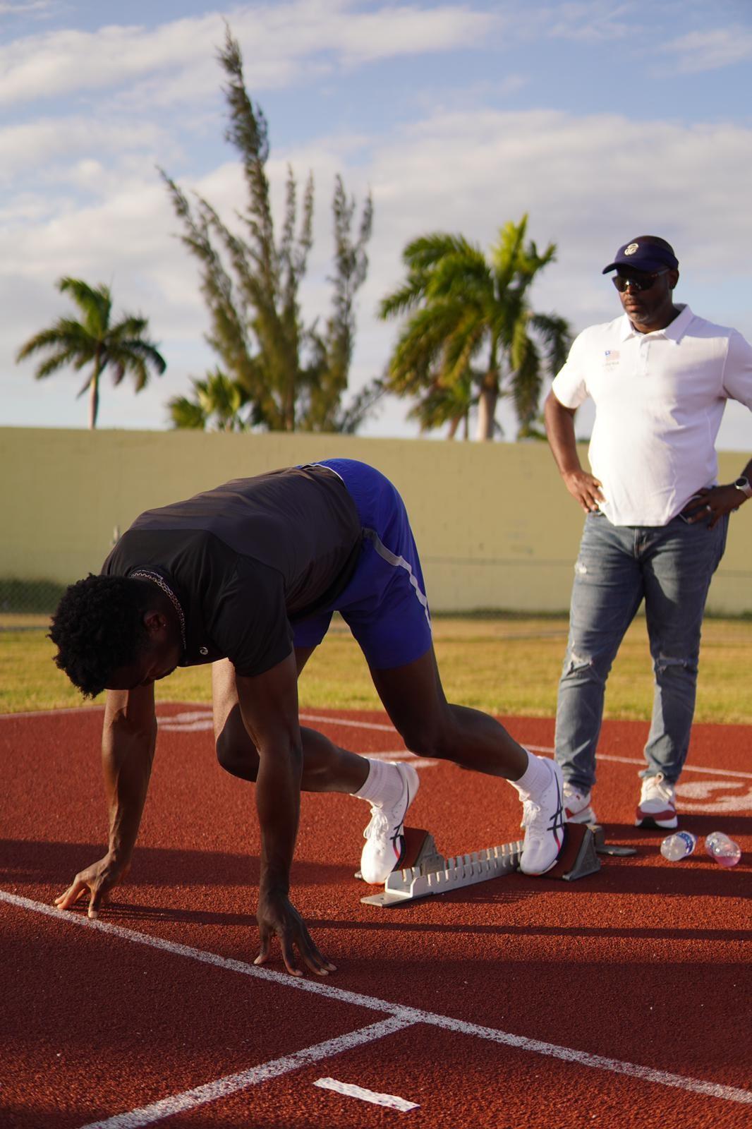Sayon Cooper coaching a track and field athlete