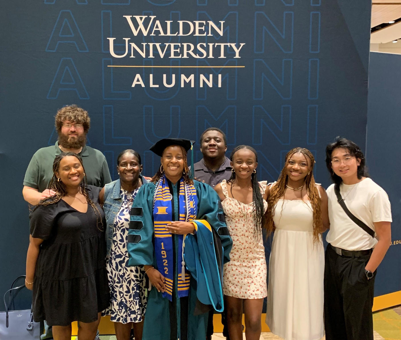 A group of people posing for a photo at a graduation