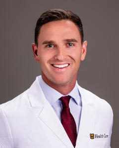 a headshot of Dr. Garrett Jackson