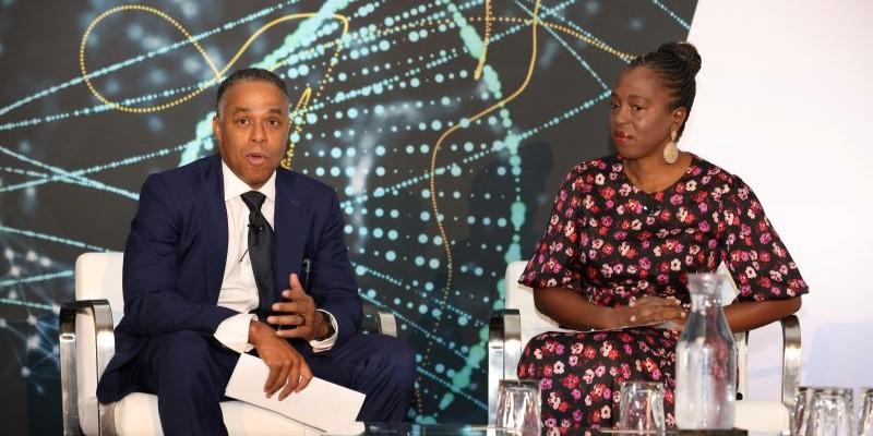 Steve Beard and Dr. Ngozi Ezike speaking on stage