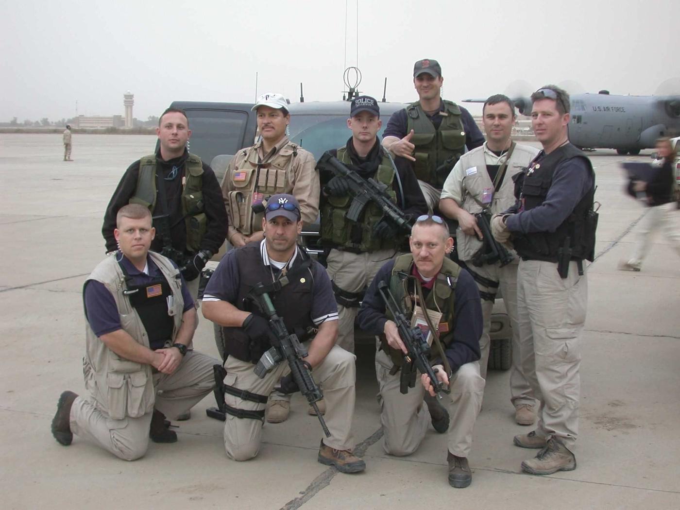 Group of men posing for photo