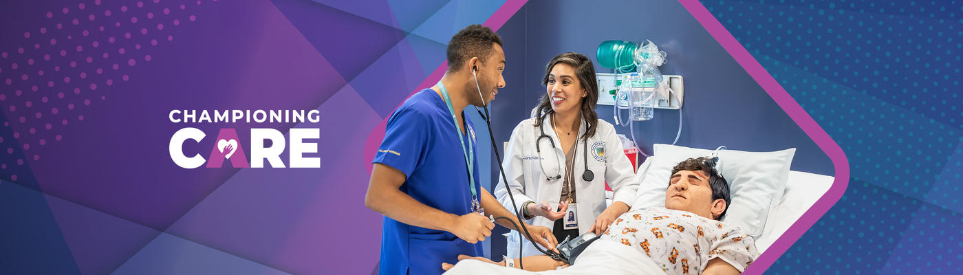 Two medical professionals speaking next to training patient.