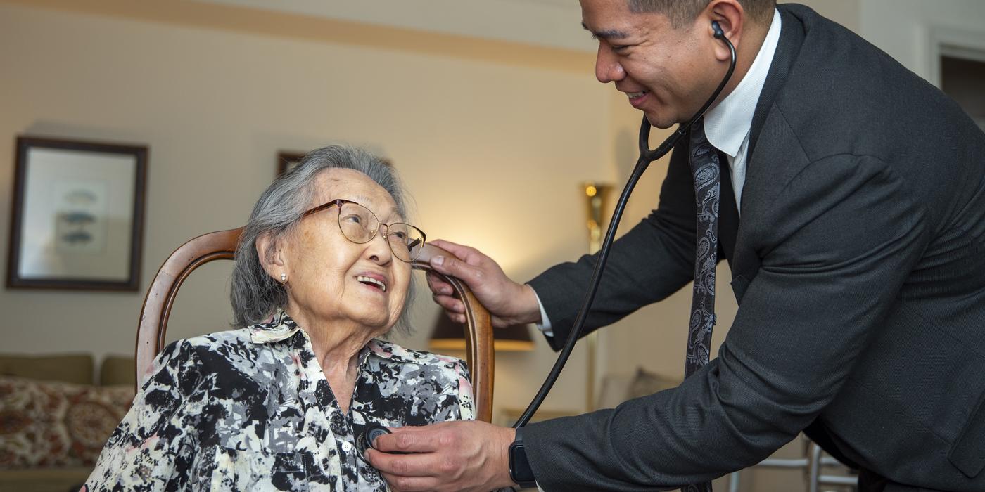 Dr. Christopher Paredes examining a patient