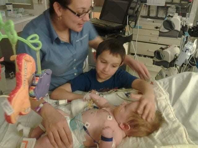 Viviana with both of her children in the hospital