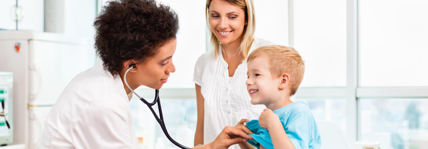 doctor examining a child with a stethoscope