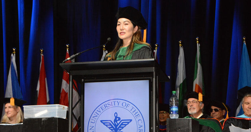 commencement speaker at a podium