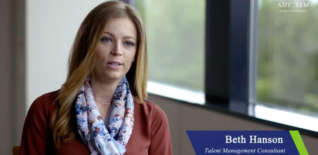 Video still frame of Beth Hanson in an interview