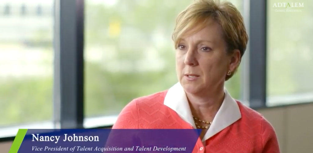 Video still frame of Nancy Johnson in an interview