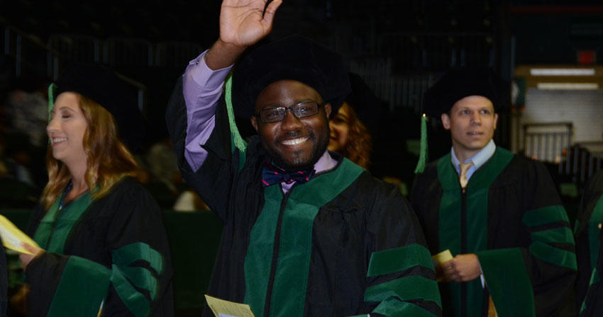 graduates at commencement