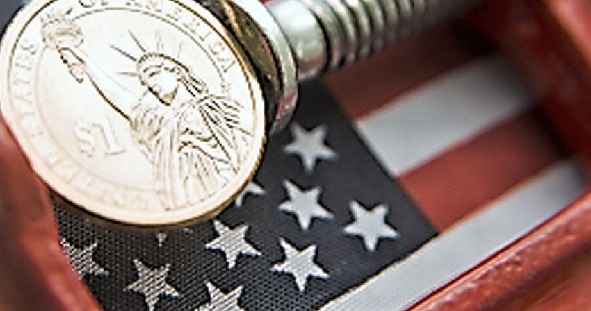 macro photo of coins on top of an American flag