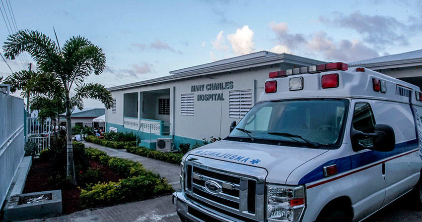 An ambulance parked in front of a hospital building