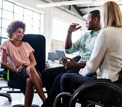 group of people talking in an office