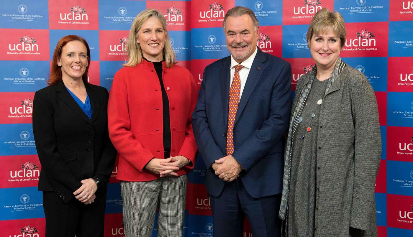 leaders posing in front of a backdrop