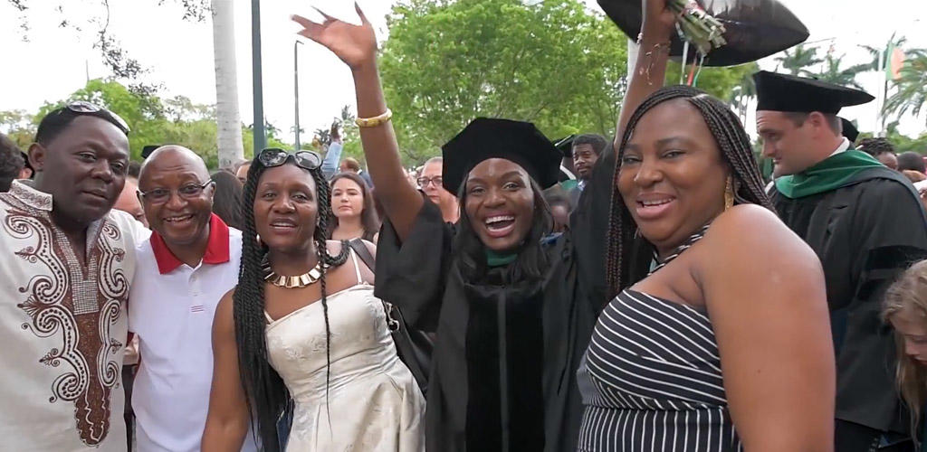 graduate celebrating with family